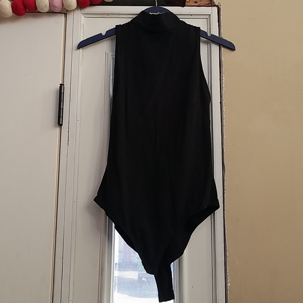 High neck, lattice back, snap bottom body suit